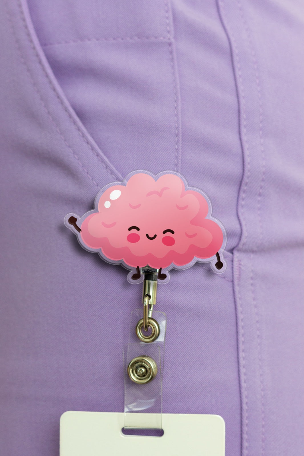 Adorable cartoon brain badge reel on purple scrubs