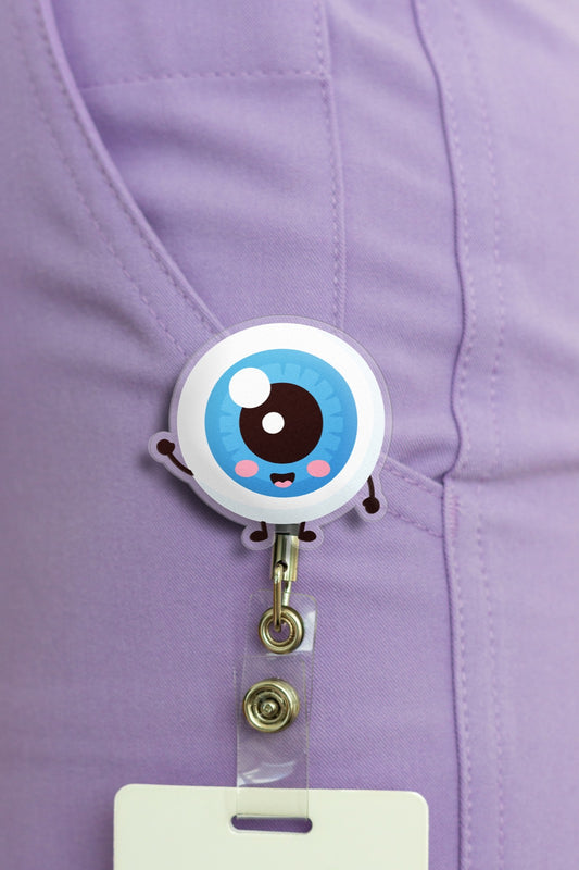 Cute cartoon eye badge reel hooked on purple scrub pocket
