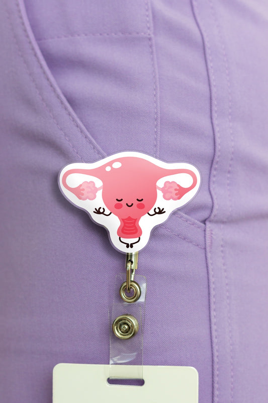 Cute uterus nurse badge reel on purple scrubs